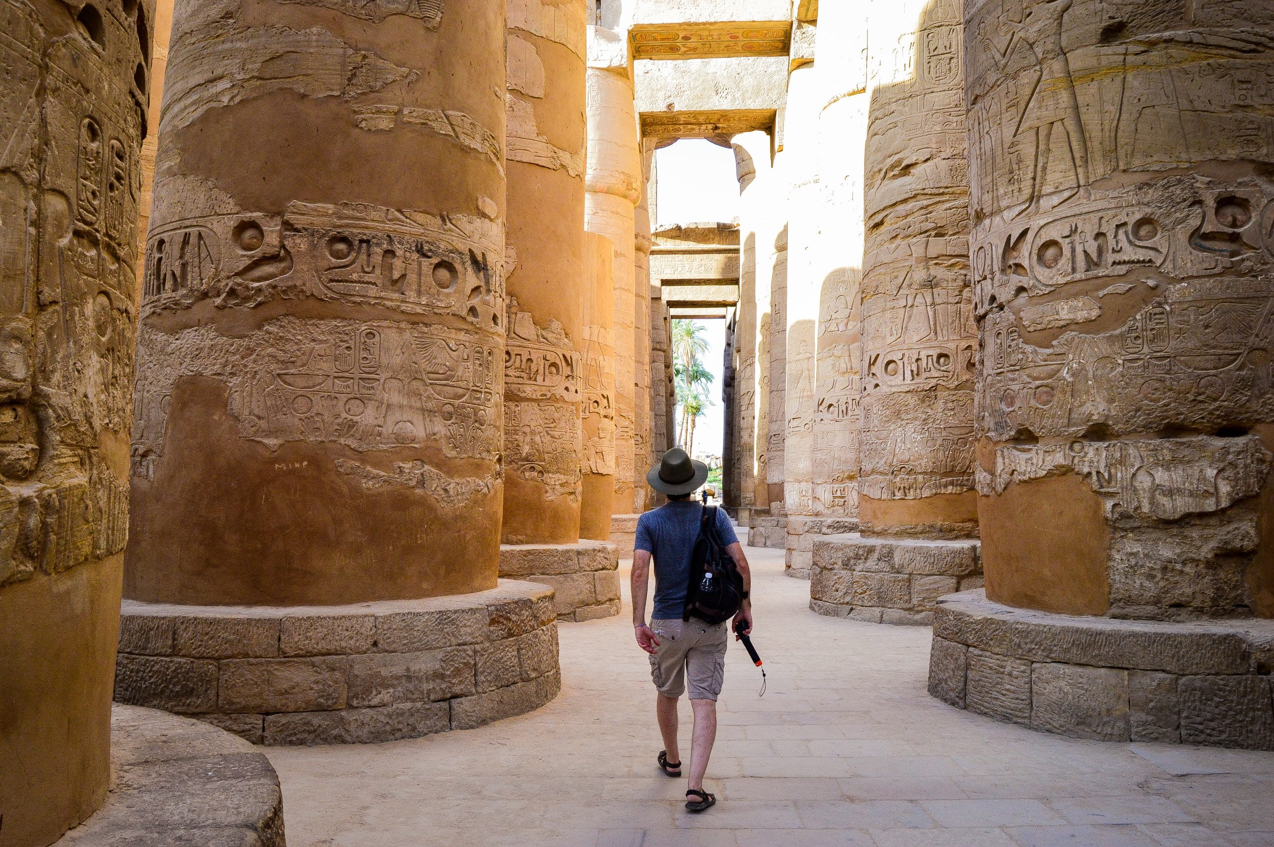 young man walking egyptian temple 1 scaled