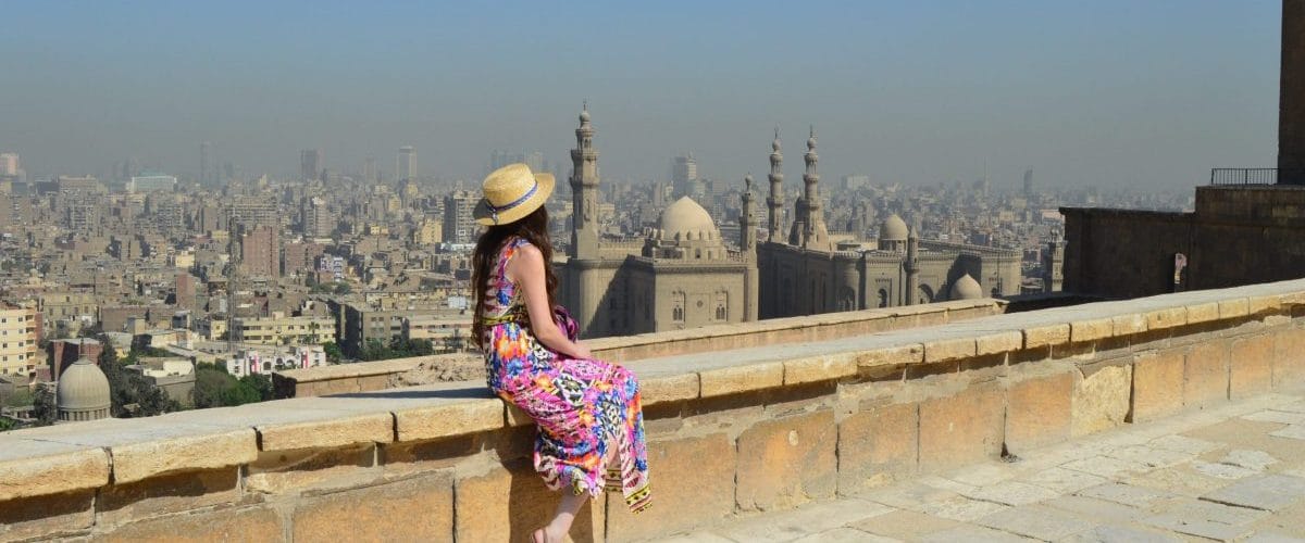 young female tourist enjoying beautiful view ancient citadel el khalifa egypt scaled e1708718519543